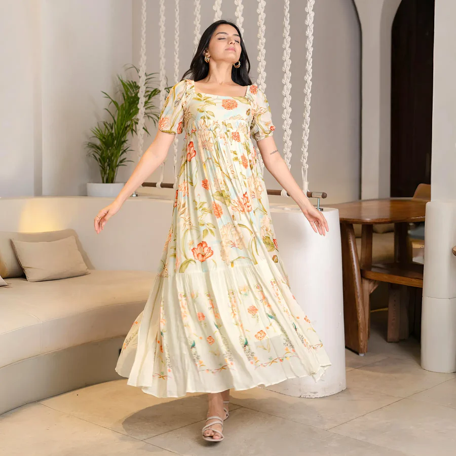 Woman in cream floral dress enjoying a calm moment indoors.